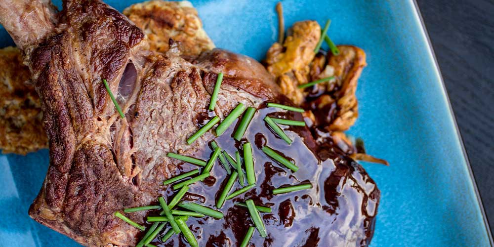 Grass-Fed Beef Cowboy Steaks with Porter Chocolate Sauce