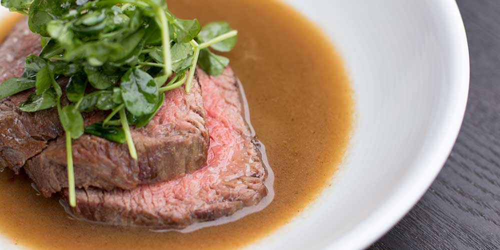 Grass-Fed Angus Tri Tip with Savory Yuzu Butter & Pea Shoot Salad