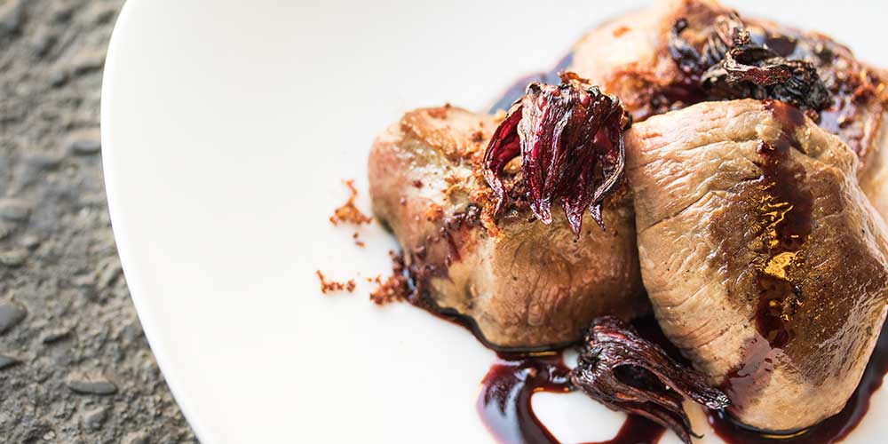 Merino Medallions with a Hibiscus Gastrique, Fried Blossoms & Sumac Dust