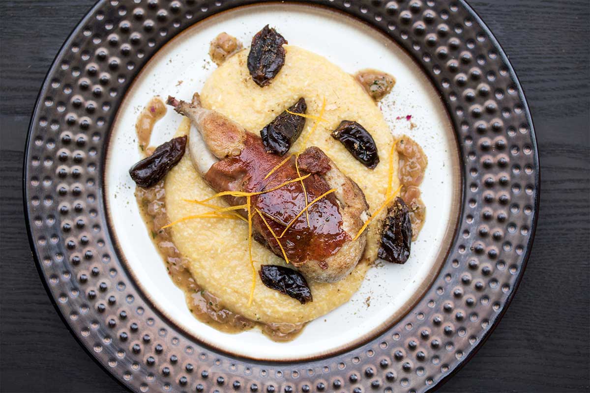 Prosciutto-wrapped quail, orange blossom-scented polenta & a pan sauce